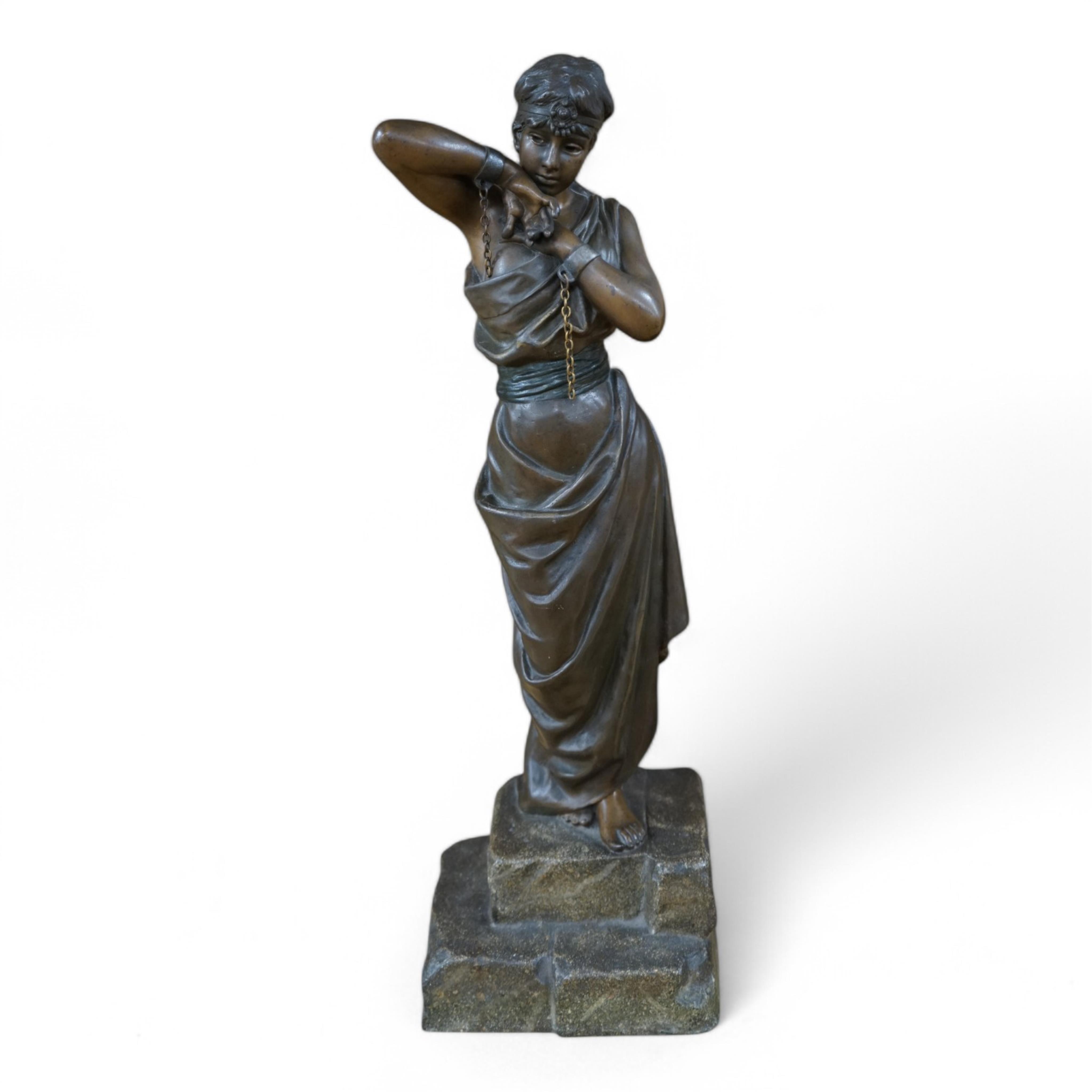 A bronzed spelter figure of a bound woman, signed E. Villanis, 56cm high. Condition - good, chain broken